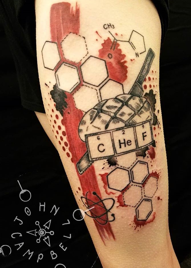 Black Grey and Red Period Table Chef Tattoo with Bread and Bread Knife by Tattoo Artist John Campbell created in Durham, NC at Sacred Mandala Studio.